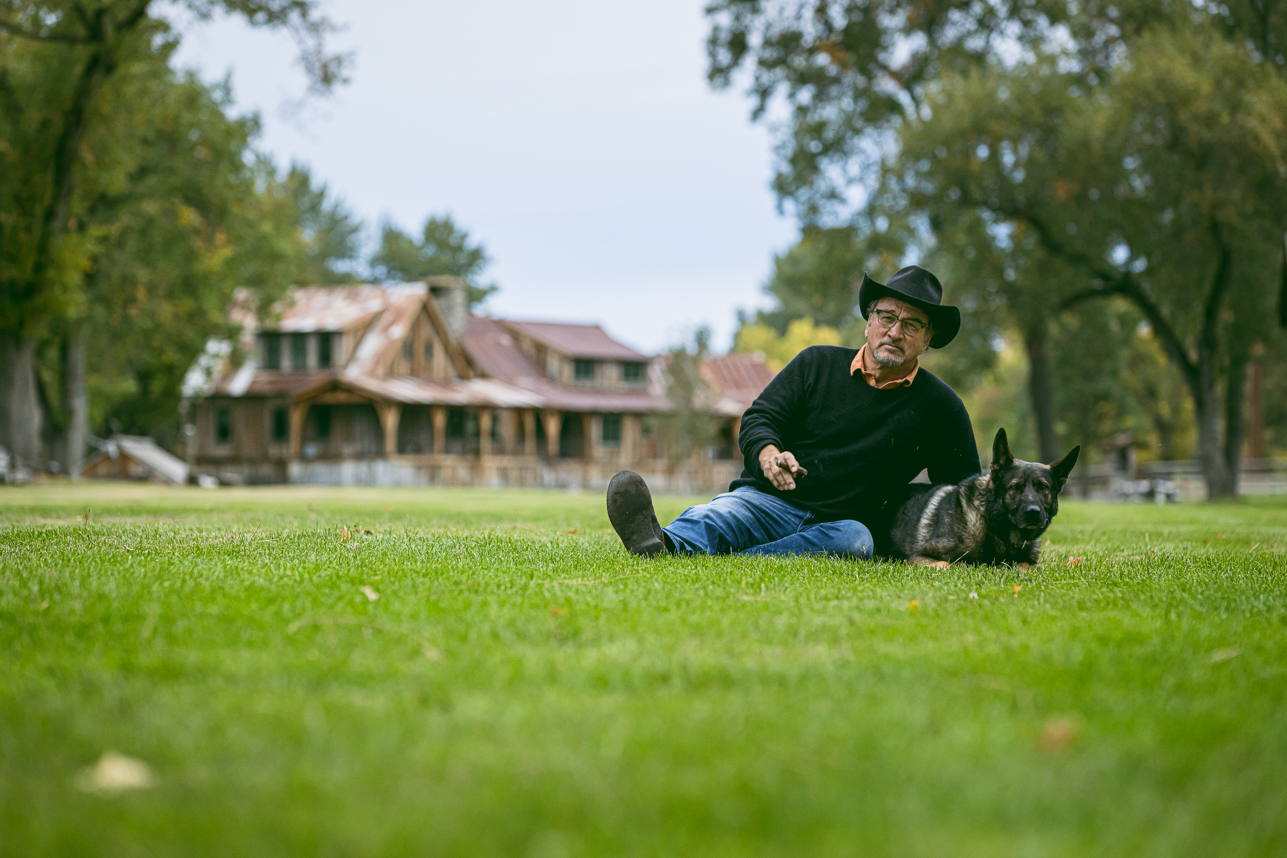 Jim Belushi and his German shepherd at the farm